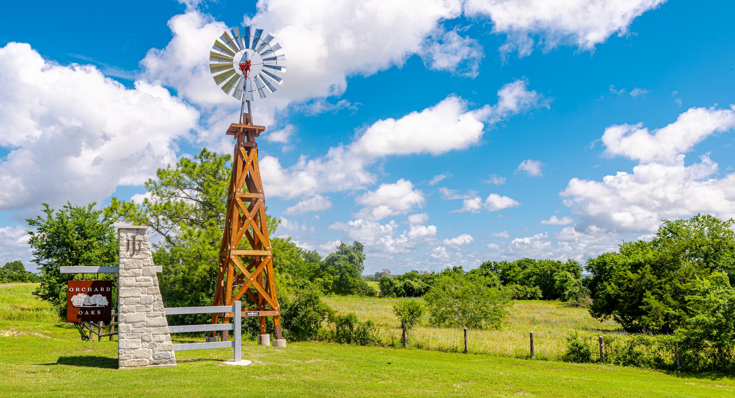 Windmill in a grassy countryside